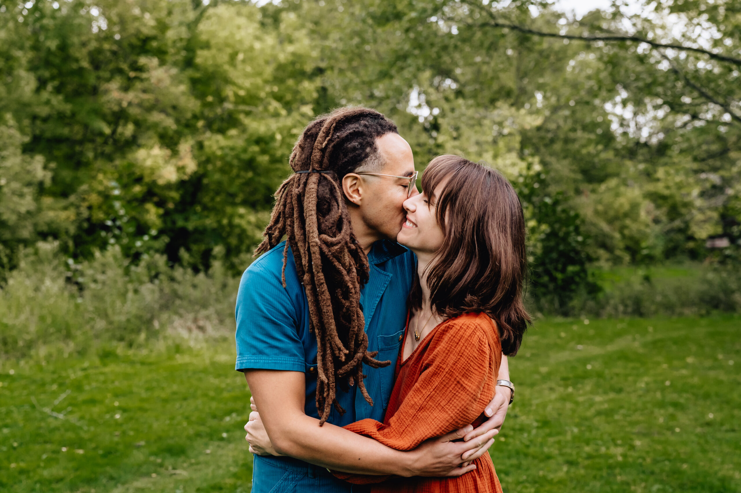 husband giving wife a kiss on the cheek 