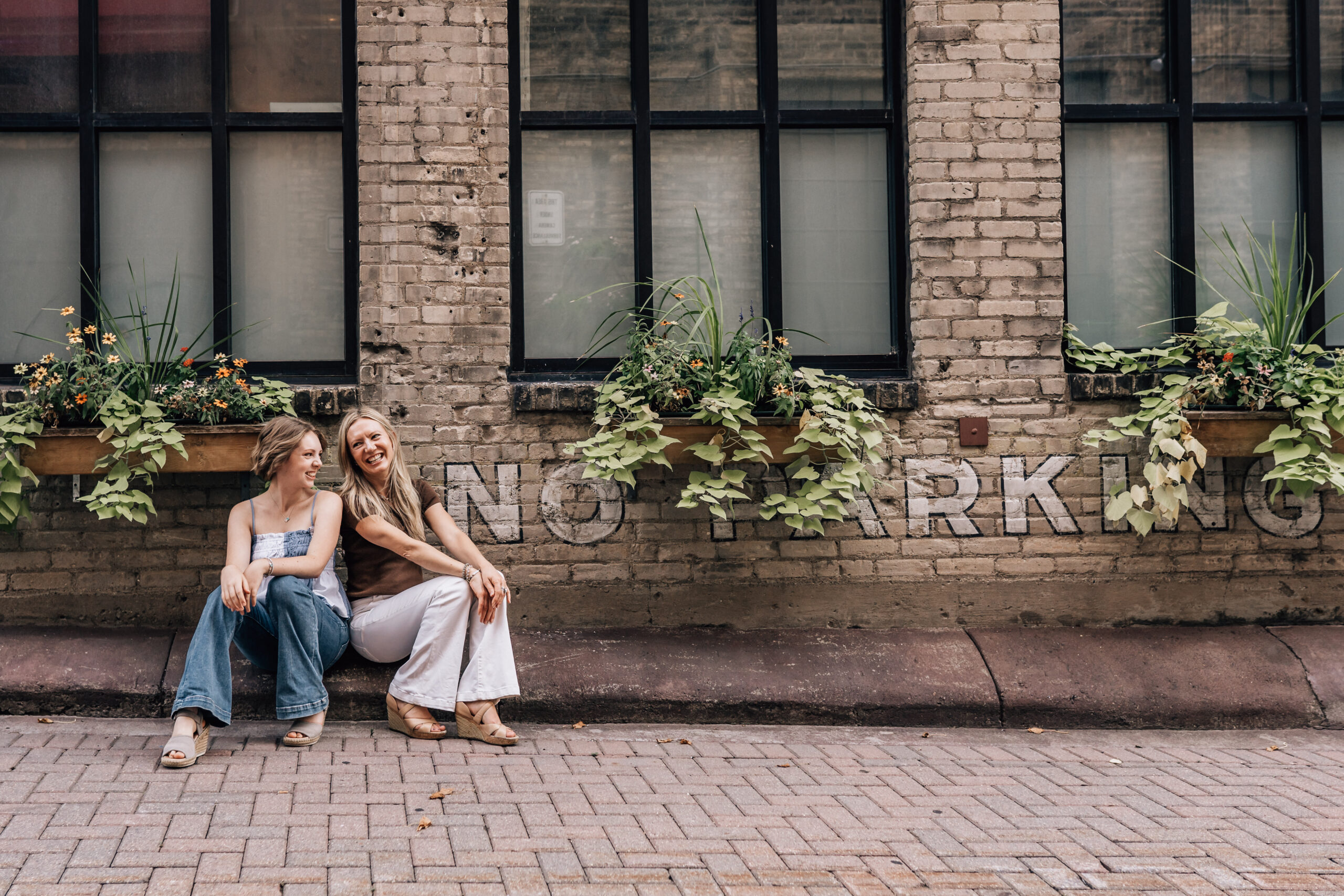 two sisters sitting and laughing 