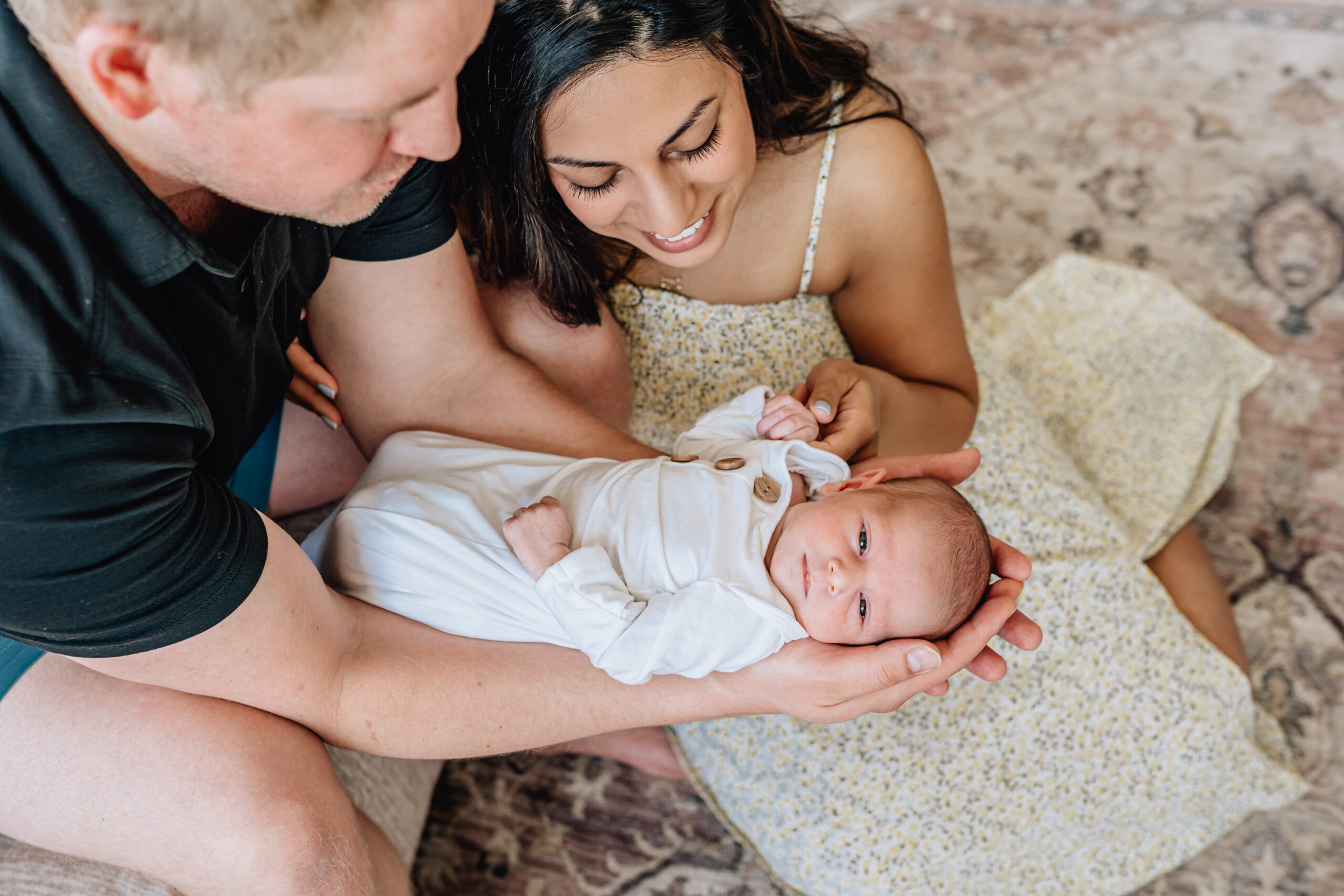 mother, father, and newborn